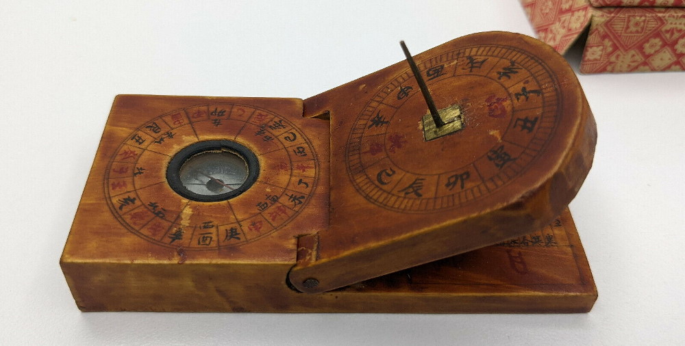 Compass with sundial